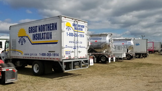 The participating Great Northern Insulation truck waits in line with other participating convoy trucks.